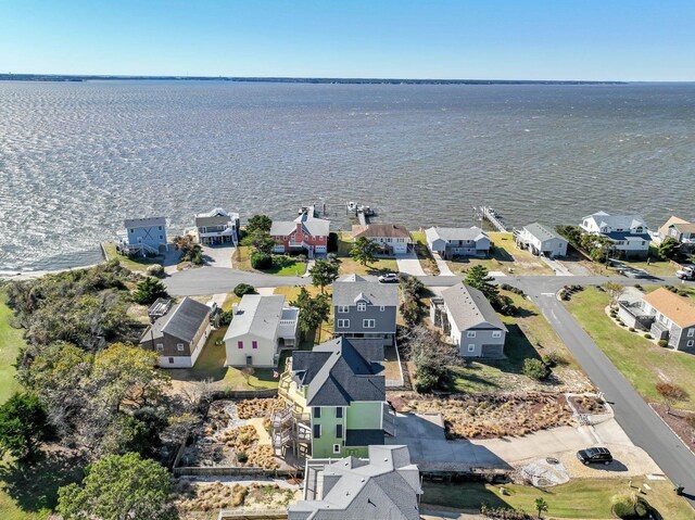 bird's eye view featuring a water view and a residential view