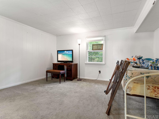 bedroom with carpet floors, baseboards, and ornamental molding