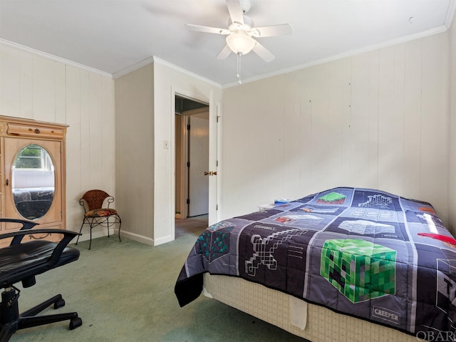 carpeted bedroom with ceiling fan, baseboards, and crown molding