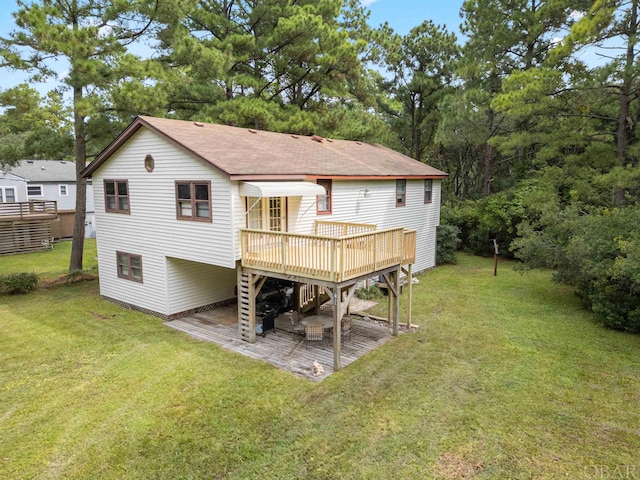 2381 Swan Island Rd Lot # 16, Corolla, NC 27927 - rear view of house with a shingled roof, a lawn, and a wooden deck