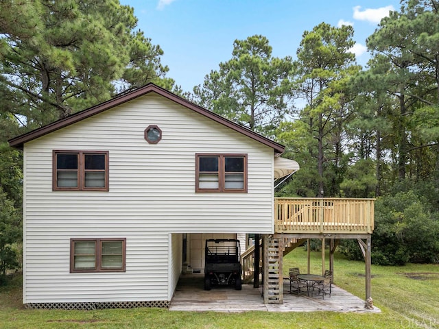 2381 Swan Island Rd Lot # 16, Corolla, NC 27927 - rear view of house featuring a lawn, stairs, a deck, a patio area, and a carport
