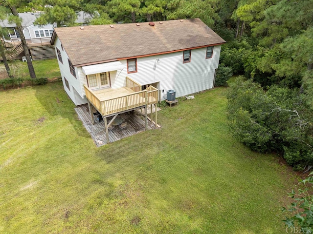 2381 Swan Island Rd Lot # 16, Corolla, NC 27927 - rear view of house with central AC, a yard, roof with shingles, and a wooden deck