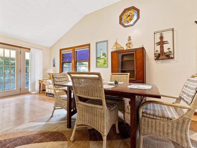 dining space featuring lofted ceiling