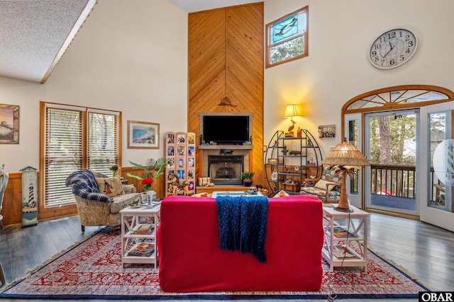 119 Baycliff Trl Lot 119, Kill Devil Hills, NC 27948 - living area with high vaulted ceiling, wood-type flooring, wood walls, and a fireplace