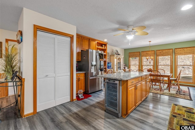 119 Baycliff Trl Lot 119, Kill Devil Hills, NC 27948 - kitchen with beverage cooler, stainless steel fridge with ice dispenser, dark wood finished floors, ceiling fan, and recessed lighting