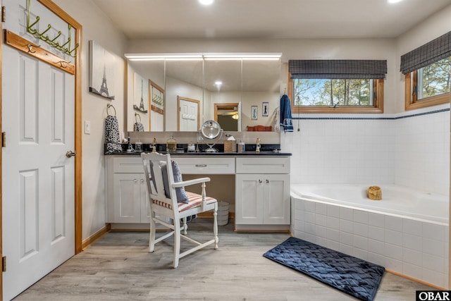 119 Baycliff Trl Lot 119, Kill Devil Hills, NC 27948 - full bath featuring double vanity, a bath, wood finished floors, and recessed lighting