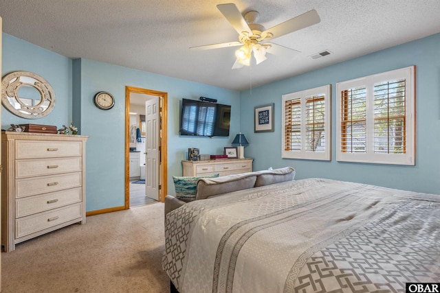 119 Baycliff Trl Lot 119, Kill Devil Hills, NC 27948 - bedroom featuring a textured ceiling, light colored carpet, a ceiling fan, and baseboards