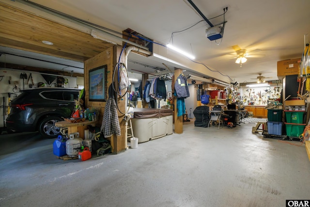 119 Baycliff Trl Lot 119, Kill Devil Hills, NC 27948 - garage with a ceiling fan, a garage door opener, and a workshop area
