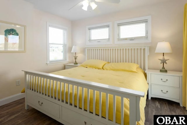 bedroom with ceiling fan, baseboards, and wood finished floors