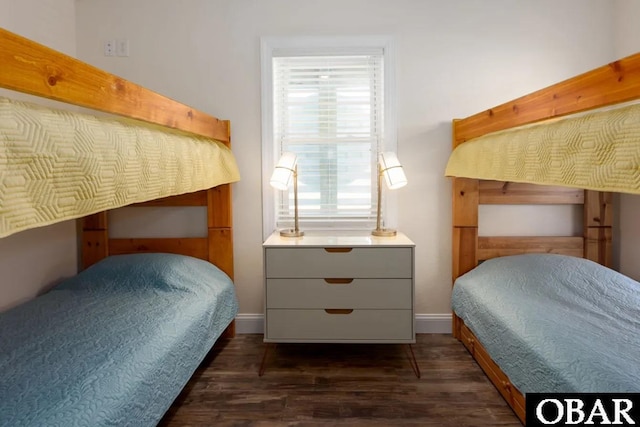 bedroom featuring dark wood-type flooring and baseboards