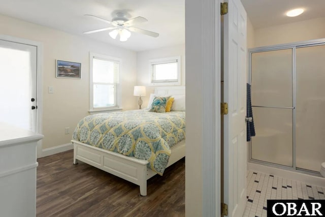 bedroom featuring dark wood-style flooring, baseboards, and ceiling fan