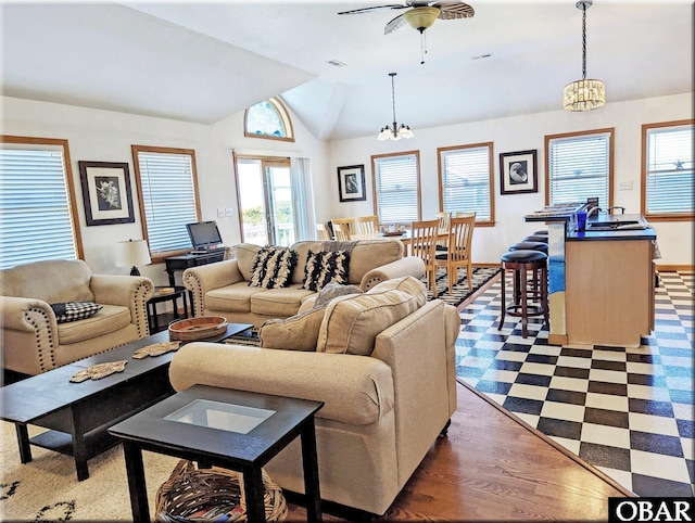 27211 Dory Rd Lot 22, Salvo, NC 27972 - living area with vaulted ceiling, a chandelier, dark flooring, baseboards, and a ceiling fan