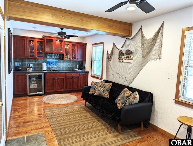 27211 Dory Rd Lot 22, Salvo, NC 27972 - indoor wet bar featuring wine cooler, ceiling fan, light wood-style flooring, and backsplash
