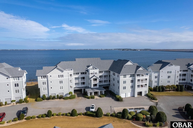 birds eye view of property with a water view