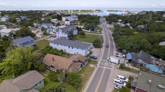 birds eye view of property featuring a water view and a residential view