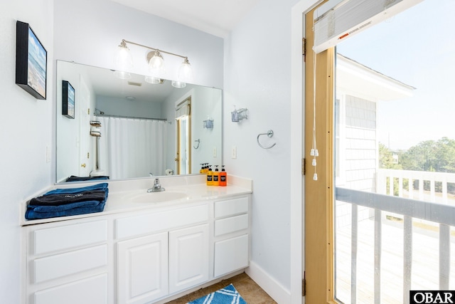 full bath with vanity, a shower with curtain, and tile patterned flooring