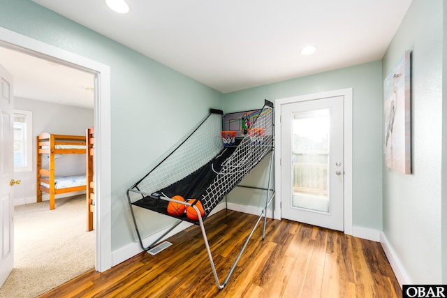 interior space with recessed lighting, visible vents, wood finished floors, and baseboards