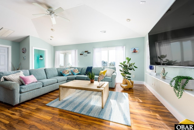 living room featuring visible vents, wood finished floors, ceiling fan, and vaulted ceiling