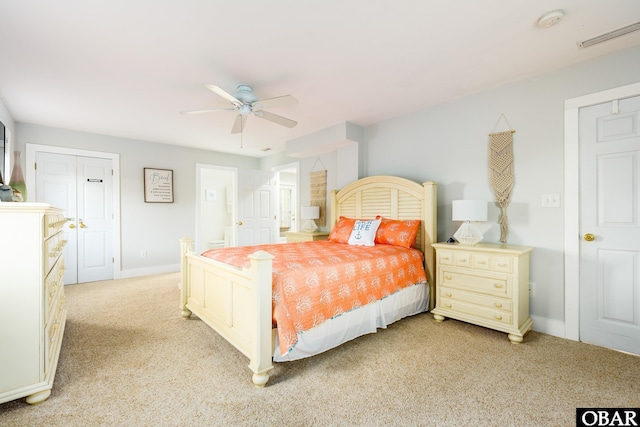 bedroom featuring a ceiling fan, visible vents, light carpet, and baseboards