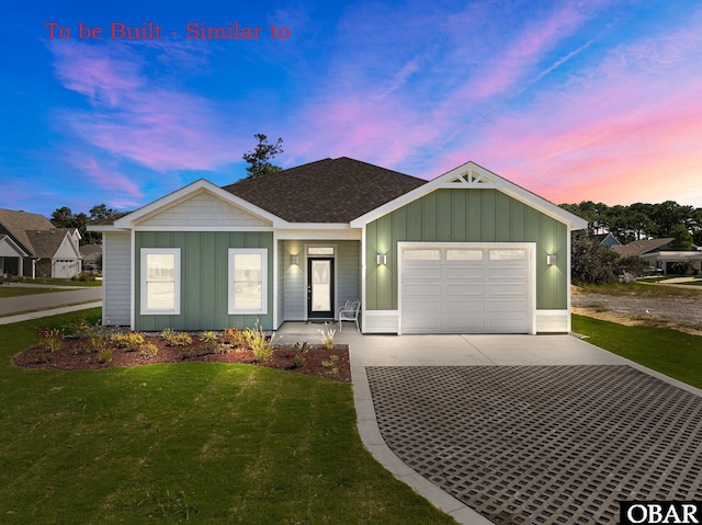 view of front facade with board and batten siding, concrete driveway, a garage, and a front yard