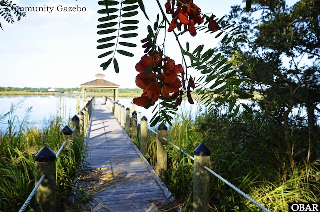 dock area featuring a gazebo and a water view