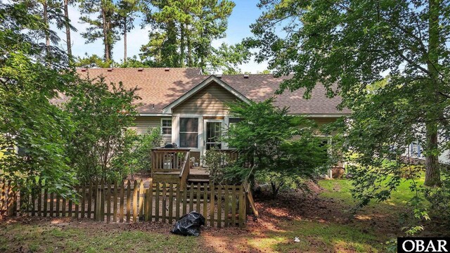 116 First Colony Ct Lot 4, Manteo, NC 27954 - view of front of property featuring a deck, a shingled roof, and a sunroom