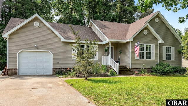 116 First Colony Ct Lot 4, Manteo, NC 27954 - view of front of property featuring a front lawn, roof with shingles, and driveway