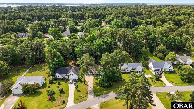 116 First Colony Ct Lot 4, Manteo, NC 27954 - aerial perspective of suburban area with a heavily wooded area