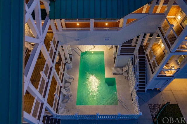 view of pool featuring stairs