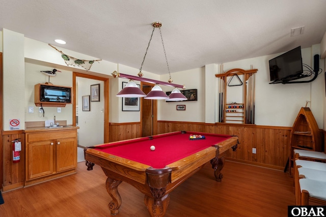 25270 Sea Isle Hills Dr Lot 5-18, Waves, NC 27982 - game room with light wood-style floors, pool table, wainscoting, and wood walls
