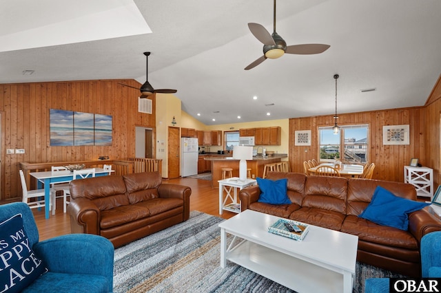 25270 Sea Isle Hills Dr Lot 5-18, Waves, NC 27982 - living area featuring light wood-style floors, ceiling fan, lofted ceiling, and wooden walls