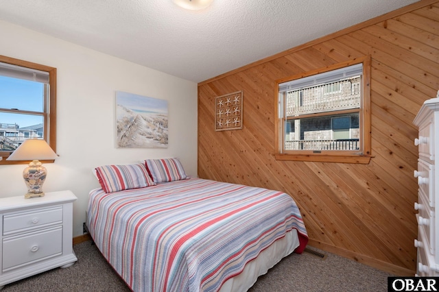 25270 Sea Isle Hills Dr Lot 5-18, Waves, NC 27982 - bedroom featuring carpet floors, wood walls, and multiple windows