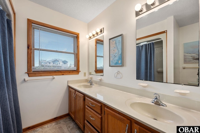 25270 Sea Isle Hills Dr Lot 5-18, Waves, NC 27982 - full bathroom featuring double vanity, a sink, baseboards, and a textured ceiling