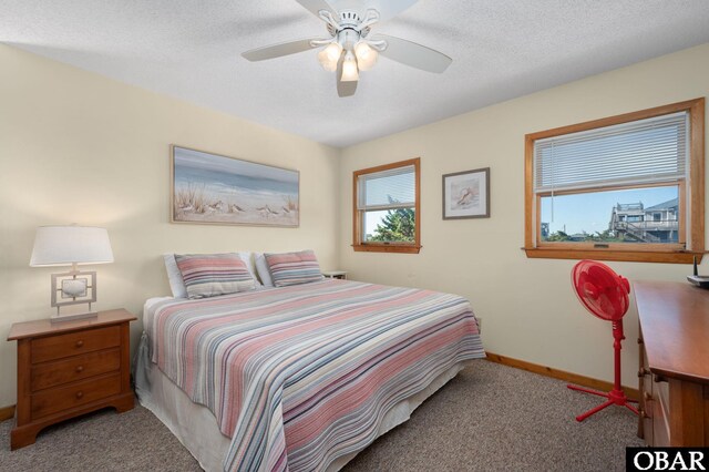 25270 Sea Isle Hills Dr Lot 5-18, Waves, NC 27982 - bedroom with baseboards, ceiling fan, and carpet flooring