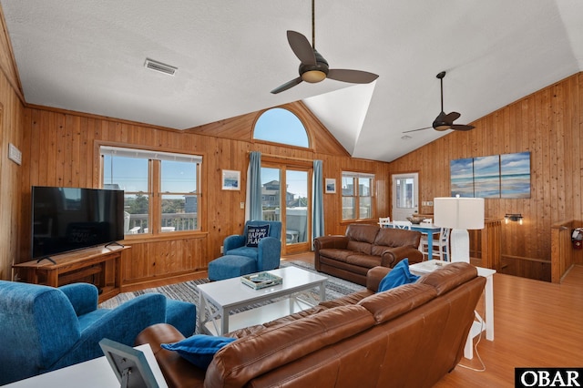 25270 Sea Isle Hills Dr Lot 5-18, Waves, NC 27982 - living room with wooden walls, ceiling fan, wood finished floors, lofted ceiling, and visible vents