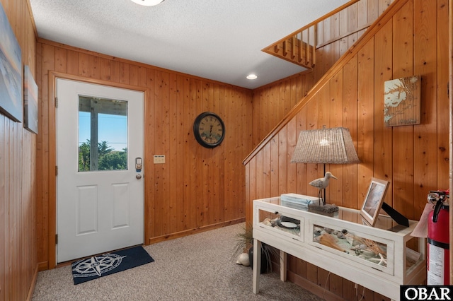 25270 Sea Isle Hills Dr Lot 5-18, Waves, NC 27982 - foyer entrance with wooden walls, stairway, and carpet
