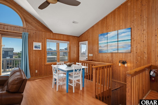25270 Sea Isle Hills Dr Lot 5-18, Waves, NC 27982 - dining room featuring wooden walls, a ceiling fan, and vaulted ceiling