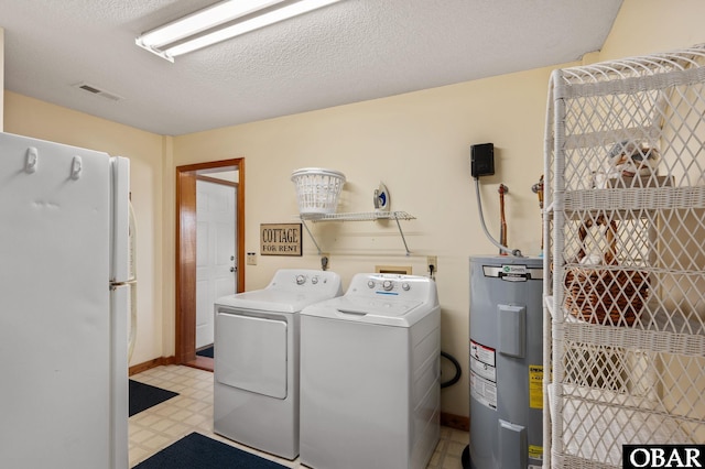 25270 Sea Isle Hills Dr Lot 5-18, Waves, NC 27982 - washroom featuring electric water heater, laundry area, visible vents, light floors, and washer and clothes dryer