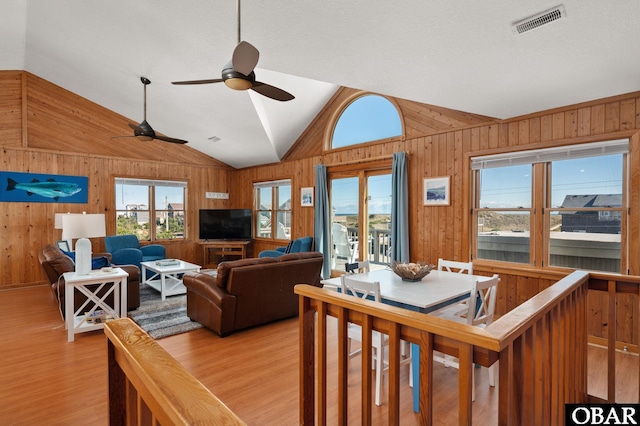 25270 Sea Isle Hills Dr Lot 5-18, Waves, NC 27982 - living room featuring wood walls, light wood finished floors, ceiling fan, and vaulted ceiling