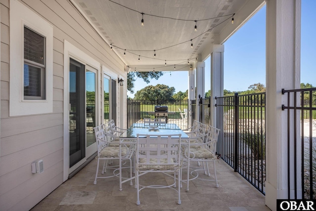 exterior space featuring a grill and outdoor dining space