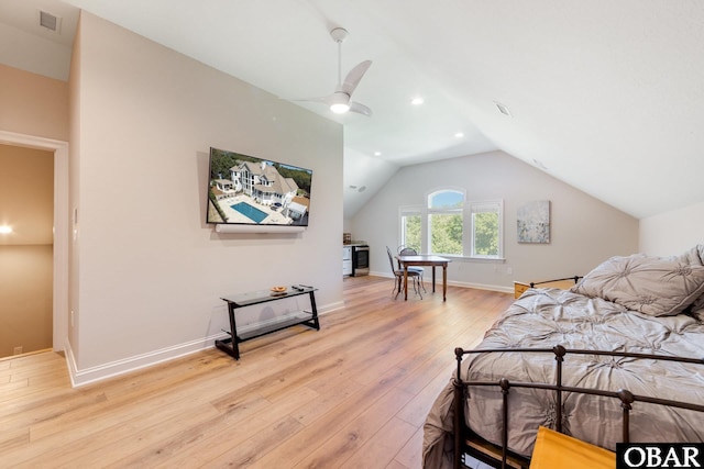 bedroom with visible vents, baseboards, light wood-style flooring, vaulted ceiling, and recessed lighting