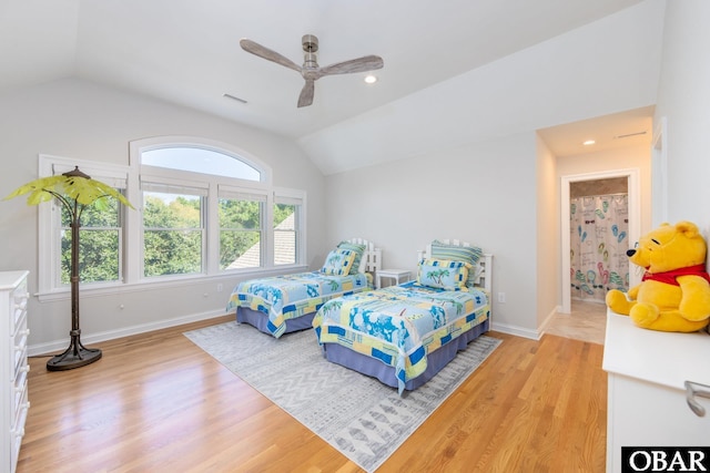 bedroom with vaulted ceiling, recessed lighting, baseboards, and light wood-style floors