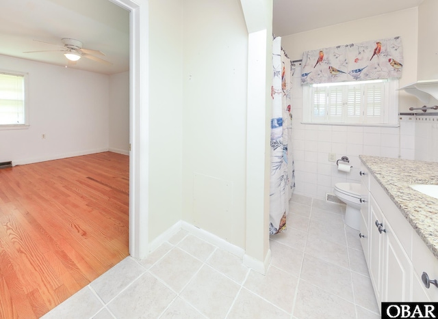 202 Winfall Blvd, Hertford, NC 27944 - full bath with tile patterned floors, ceiling fan, vanity, tile walls, and a shower with shower curtain