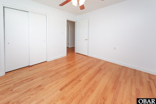 202 Winfall Blvd, Hertford, NC 27944 - unfurnished bedroom featuring light wood finished floors, a closet, and a ceiling fan
