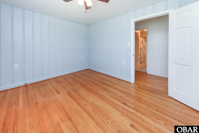 202 Winfall Blvd, Hertford, NC 27944 - empty room featuring light wood-style floors, a ceiling fan, and crown molding