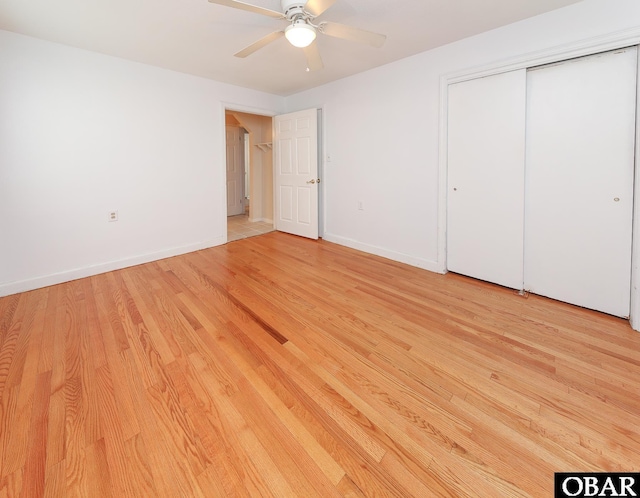 202 Winfall Blvd, Hertford, NC 27944 - unfurnished bedroom featuring light wood-style flooring, a closet, and a ceiling fan