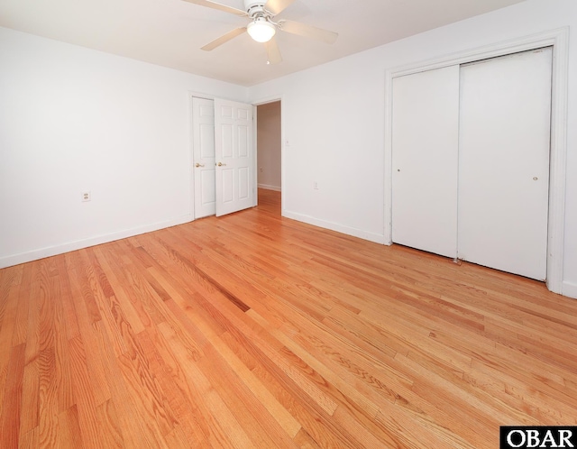 202 Winfall Blvd, Hertford, NC 27944 - unfurnished bedroom with light wood-style flooring, a closet, and a ceiling fan