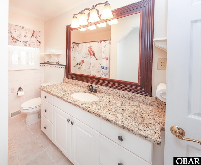202 Winfall Blvd, Hertford, NC 27944 - bathroom with vanity, tile patterned flooring, and tile walls