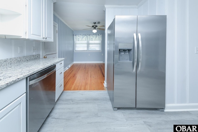 202 Winfall Blvd, Hertford, NC 27944 - kitchen with appliances with stainless steel finishes, light wood-style floors, white cabinetry, ceiling fan, and ornamental molding