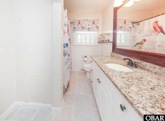 202 Winfall Blvd, Hertford, NC 27944 - bathroom with tile patterned floors, vanity, tile walls, and a shower with shower curtain